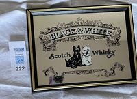 Front view of Black & White Scotch Whisky mirrored ad in frame
