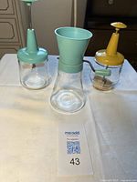 Front view of three Androck choppers standing upright