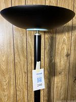 Close view of saucer shade and upper pole