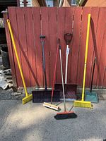 All tools standing against fence showing quantity and type