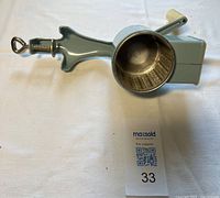 Grinder assembled showing clamp and drum interior