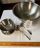 Top view showing serving bowl, gravy boat, two ladles