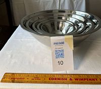 Nested stainless steel bowls showing size gradation