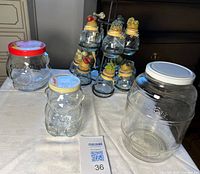 Group showing spice jars on rack and three larger jars