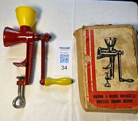 Full view of grinder disassembled beside box