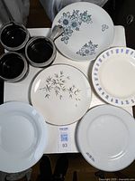 Overview of three onion soup bowls and five of the vintage plates