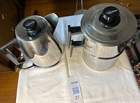 Electric and countertop Lifetime stainless percolators side by side