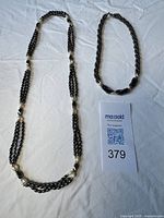 Both necklaces side by side showing overall design and bead types