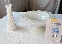 Compote and bud vase side by side on table