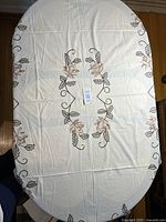 Full view embroidered floral tablecloth on table