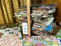 Full stack of folded wrapping paper measured against ruler