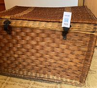 Front view of wicker trunk showing latches and weave