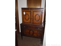Full view of the two-piece vintage Empire brand wooden dresser showing overall shape, finish and dimensions.