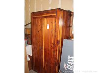 Front view of closed cedar storage closet