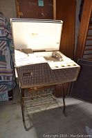 Front view of Zenith hi-fi console with lid open showing turntable and control knobs