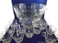 Overall view showing punch bowl, handled cups hanging, and plastic hooks included.