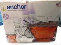 Box packaging showing brand Anchor Hocking, punch bowl set, 18 pieces, with image of punch bowl filled with punch and cups hanging on hooks.