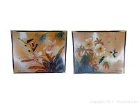 Front view of both framed lithographs with floral and bird designs.