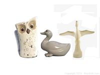 Three ceramic animal figurines: owl, duck, and goose.