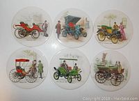 Full set of six round ceramic trivets featuring vintage automobile illustrations and period-dressed figures in early 20th century scenes.