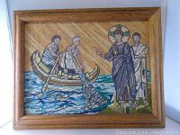 Frontal view of the framed vintage cross-stitch artwork depicting "Peter and Andrew Followed Jesus" in vibrant colors.