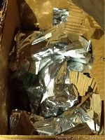 Box containing 8 assorted electronic components from Amico enclosed in silver anti-static bags, packaging slightly damaged.