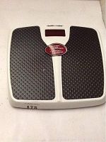Health O Meter white and black digital bathroom scale showing textured footpads and digital display.