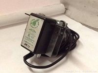 Photo of Light Rail Intellidrive 3.5 electronic grow light driver unit with power cord and metal mounting bracket.