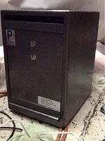 Front and side view of a Protex Safe Co Model TC-03K safe showing deposit slot, dual locks, and label.