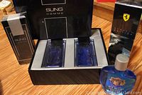Photo showing Sung Homme boxed set with two blue glass spray bottles and Ferrari Classic Edition box.