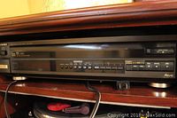 Front view of Technics Multi 5 CD player showing control buttons, disc tray, and display.