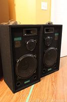 Pair of black Grafdale Pro Series stereo speakers showing front view with grills and drivers.