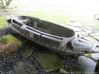 Port side view of entire camouflage molded plastic hull
