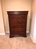 Front view of chest of drawers showing five drawers
