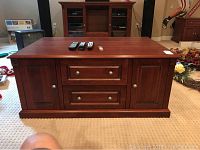 Front elevation of coffee table showing drawers and cabinets