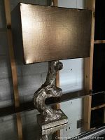 Full view of wooden tree branch lamp with brown rectangular fabric shade, showing overall look and height.