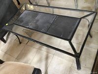 Full view of rectangular coffee table with iron frame, slate panels under clear glass top, showing overall condition and design