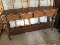 Front view of the pine console table showing two drawers and lower shelf.