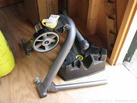 Close view of resistance unit and adjustment lever on the CycleOps Wind Trainer, highlighting functional adjustment.