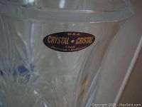 Close-up of the label on one candle holder showing 'CRYSTAL - CRISTAL Lead' marking, made in USA.