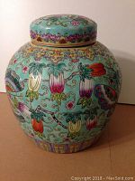 Front view of jar with lid on top showing body and lid design