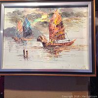 Painting of two Filipino sailboats with colorful sails on calm water under a cloudy sky, framed with light gray frame