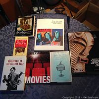 All books shown together on table, varied colors and sizes