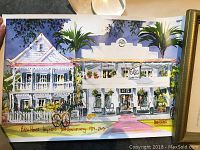 Unframed watercolor painting of Eden House in Key West, showing a detailed building with palm trees and foliage, vibrant colors, signed and dated 1975-2005.