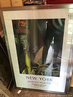Full front view of one framed print showing Statue of Liberty torch and hand, signed Martha Murphy, labeled 26x38 inches.