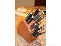 Full view of knife set in wooden block showing all knives and shears.