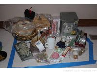 Photo showing entire lot including ice bucket, cheese boards, candles, dishes, and wine accessories laid out on floor