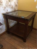 Side view of the La-Z-Boy side table showing wood frame, lower shelf, and leg design.