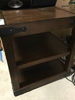 Overall side view showing two shelves and distressed wood construction with metal accents