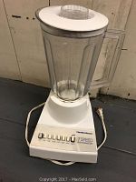 Full view of Hamilton Beach 7 Speed Blendmaster Blender with plastic pitcher and lid, power cord visible.